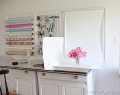 a white refrigerator freezer sitting on top of a counter next to a wooden chair