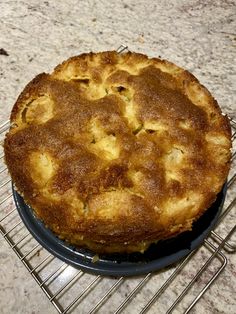 a pie sitting on top of a metal rack