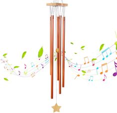 a wind chime with musical notes and leaves on the top, hanging from a star