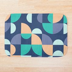 a bath mat with an abstract design on it