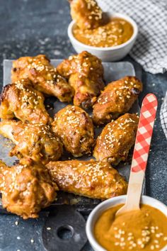 chicken wings with dipping sauce on the side