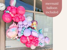 there is a mermaid balloon attached to the door