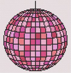 a cross stitch ornament with pink and red squares in the shape of a ball