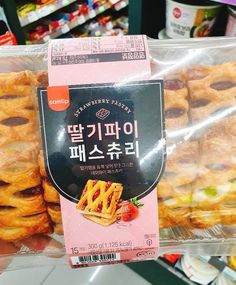 some kind of pastry in a plastic bag on display for people to buy it at the store