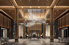 a large chandelier hanging from the ceiling in a room with wood paneling