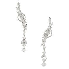 1950's Marquise and round diamond long dangle earrings in 14k white gold settings. 22 Marquise diamonds with two round dangles at the bottom. 2.40 inches long. 22 Marquise diamonds, approx. total weight 3.60cts, H – I, SI1 – I 1 6 round diamonds, approx. total weight 1.90cts, H, SI1 – SI2 14k white gold Tested and stamped: 14k 9.9 grams Top to bottom: 60.99mm or 2.40 inches Width: 9.11mm or .36 inch Depth: 2.98mm Dangle Diamond Earrings, Antique Wedding Bands, Diamond Sapphire Engagement Ring, Antique Engagement Rings Vintage, Antique Bracelets, Vintage Sapphire, Gold Dangle Earrings, Diamond Engagement Rings Vintage, Diamond Dangle Earrings