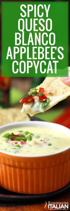 a hand holding a tortilla chip over a bowl of quesadilla