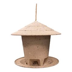 a bird feeder made out of clay with a rope hanging from it's top