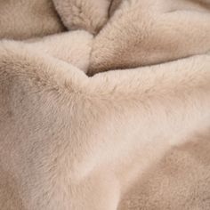 a close up view of a blanket that has been made with sheep fur and is very soft