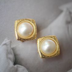 These stunning gold plated silver earrings feature a beautiful pair of hemisphere mabe pearl stones. With their intricate details and rich color, these push back studs are the perfect statement piece for any outfit. Handcrafted with care, these earrings are a true work of art and are sure to draw attention wherever you go. Whether you're looking for a unique gift or simply want to treat yourself. With their durable construction and timeless design, they're sure to become a beloved addition to yo Luxury Gold-plated Clip-on Earrings, Silver Gold-plated Clip-on Earrings For Anniversary, Silver Gold Plated Clip-on Earrings For Anniversary, Elegant Gold Clip-on Earrings As Gift, Exquisite Yellow Gold Clip-on Earrings, Elegant 14k Gold Single Clip-on Earring, Luxury Gold-plated Clip-on Jewelry, Elegant Formal Clip-on Earrings, Luxury Gold Plated Clip-on Earrings As Gift