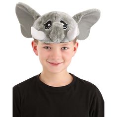 a young boy wearing an elephant hat