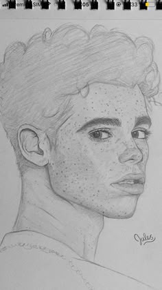 a pencil drawing of a young man with freckles on his face and hair