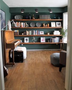 a living room filled with furniture and bookshelves