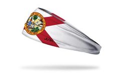 the flag of the state of florida flying in the wind with white and red stripes