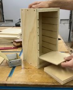 a person is working on some kind of cabinet