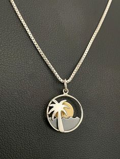 "Palm Tree Moon Necklace, Sterling Silver Palm Tree Pendant, Crescent Moon Pendant NECKLACE FEATURES: Metal:  CHAIN: All components are made from solid .925 Sterling Silver  Model is wearing 16\" in length solid .925 Sterling Silver  Chain Length available:  16\", 18\" or 20\" Measurements:  Sterling Sliver Palm Tree Moon Necklace:   Height:  23mm Width:  15mm Please send me a convo if you have any questions before placing your order.  Please also view my policy before purchasing.   Please visit Silver Moon Necklace With Charms, Tree Moon, Palm Tree Pendant, Silver Model, Necklace Moon, Whimsical Jewelry, Crescent Moon Pendant, Celestial Necklace, Sun Designs