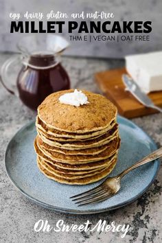 a stack of pancakes sitting on top of a blue plate