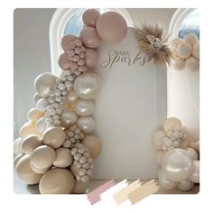 a baby shower is decorated with balloons and streamers in pastel colors, such as champagne