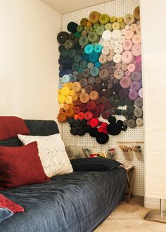 a living room filled with lots of different colored pillows