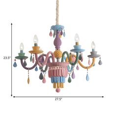 a pink chandelier hanging from the ceiling with blue and yellow trimmings