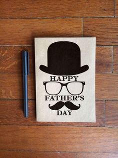 a napkin that says happy father's day with a hat and glasses on it