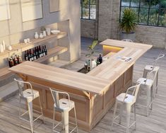 an outdoor bar with stools around it