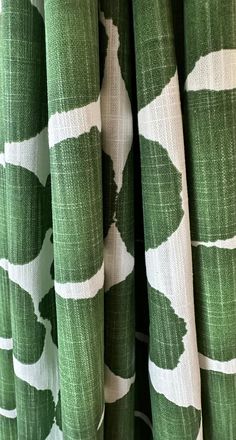 green and white curtains with leaves on them