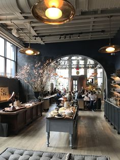 an image of a restaurant with people sitting at the tables and eating in the dining area