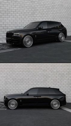 a black car parked in front of a white brick wall