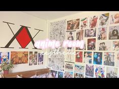 a room with many pictures on the wall and a plant in front of it that says anime room