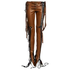 ▪ Dolce & Gabbana tan leather pants ▪ 100% Sheepskin leather ▪ Metal grommets ▪ Multiple black lace-up fastenings ▪ Three buckles at waist ▪ Four long belt straps hanging from hips ▪ Hanging metal 'D' and 'G' detail ▪ Size IT 38 - FR 34 - UK 6 - US 2 ▪ Spring-Summer 2003 Shakira Costume, Tan Leather Pants, Punk Cowgirl, Lace Up Leather Pants, Fancy Club, Silhouette Fashion, Tan Outfit, Erika Jayne, Silver Makeup