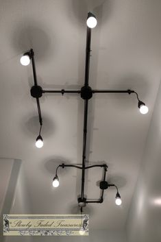 an overhead light fixture with several lights on it