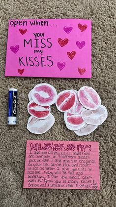 some pink paper with hearts on it next to a note that says, open when you miss my kisses