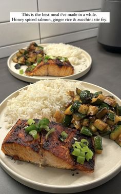 two white plates topped with fish and rice