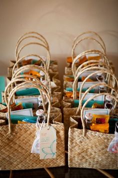 a bunch of baskets that are sitting on top of each other with tags attached to them