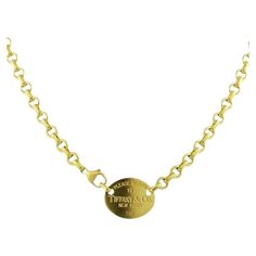 TIFFANY & Co. 18K Gold Return to Tiffany Oval Tag Necklace Metal: 18K Yellow Gold Length: 16.5" Oval tag: 22.5mm wide x 18mm high Weight: 41.60 grams Hallmark: "PLEASE RETURN TO TIFFANY & Co. NEW YORK 750" on the oval tag, "750" on the clasp Condition: Excellent condition, comes with Tiffany pouch, box, bag and ribbon bow Value: $10,700 Limited edition, no longer available for sale in Tiffany stores Authenticity Guaranteed Tiffany Setting, Tiffany Diamond, Return To Tiffany, Aquamarine Necklace, Gilded Age, Platinum Engagement Rings, Modern Necklaces, Tiffany And Co, Box Bag