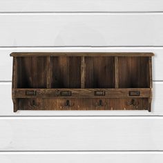 an old wooden shelf with four drawers on the front and one drawer in the back