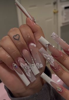 a person with long nails and bows on their fingers