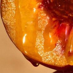 the inside of an orange with syrup on it