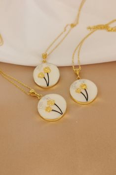 "✓ Personalized Flower Of Hair Keepsake Necklace For Women, Our Solid 925 Sterling Silver necklace with %100 hand crafted, gold workmanship is specially produced for you, Jewelry made with love for your special occasions. ---● N E C K L A C E  ∙  D E T A I L S ●--- * Pendant Diameter: 20 mm * The Chain and Pendant of the Necklace is SOLID 925 STERLING SILVER. * The pendant is made of UV stable resin. And your hair will be safe in it. * I can engrave any initial, name or numeral you want on the b Round Flower Charm Jewelry For Keepsake, Round Keepsake Jewelry With Flower Charm, Gold Flower Jewelry For Jewelry Making, Gold Jewelry With Flower Charm Keepsake, Gold Hypoallergenic Necklace With Flower Pendant, Gold Hypoallergenic Flower Pendant Necklace, Hypoallergenic Gold Necklace With Flower Pendant, Yellow Gold Flower Pendant Jewelry For Keepsake, Yellow Gold Flower Pendant Keepsake Jewelry