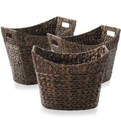 four brown woven baskets with handles on each side and one in the middle, set against a white background