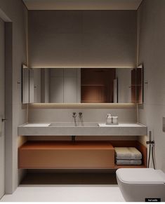 a modern bathroom with two sinks and a toilet