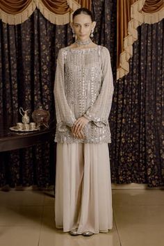 Ivory A-line short kurta embellished with silver gota applique, aari and zardozi hand embroidery. Paired with a palazzo. - Aza Fashions Short Kurta, A Line Shorts, Aza Fashion, Boat Neck, Full Sleeve, Hand Embroidery, Chiffon, Embroidery, Silver