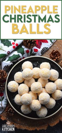 pineapple christmas balls in a black bowl on top of a table with pine cones