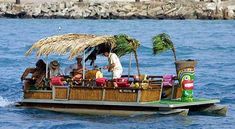 a group of people riding on the back of a boat