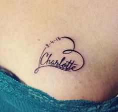 a woman's stomach with the word charlotte written in cursive writing on it