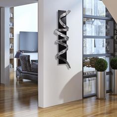 a living room with wooden floors and white walls