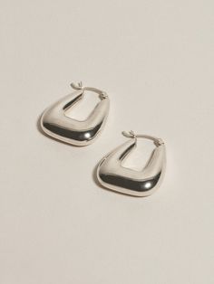 A pair of classic hoops, designed as a study in balancing 80s-esque volume with architectural elegance. Our timeless, softly triangular Tetra Hoops II personify the signature styles we keep in continual rotation. Wear them alone as a subtle statement or easily layer alongside other earrings (we love how they look doubled up alongside their more minimal counterpart, the Tetra Hoops I). The Tetra Hoops II are sold as a pair and measure approximately 22mm with a collective weight of 11.2 grams (in Jewelry Texture, J Hannah, Winter Date Outfits, Sparkly Outfits, New Years Eve Outfits, Silver Accessories, Date Outfits, Jewelry Inspo, Ear Jewelry