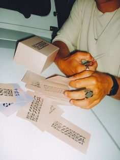 a person sitting at a table with some papers