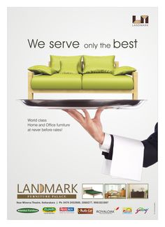 an advertisement for landmark furniture with a green couch and pillows on the tray in front of it